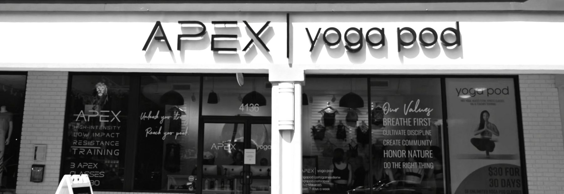 The APEX | yoga pod storefront at 4136 NW 16th Blvd, with the sign above the studio windows